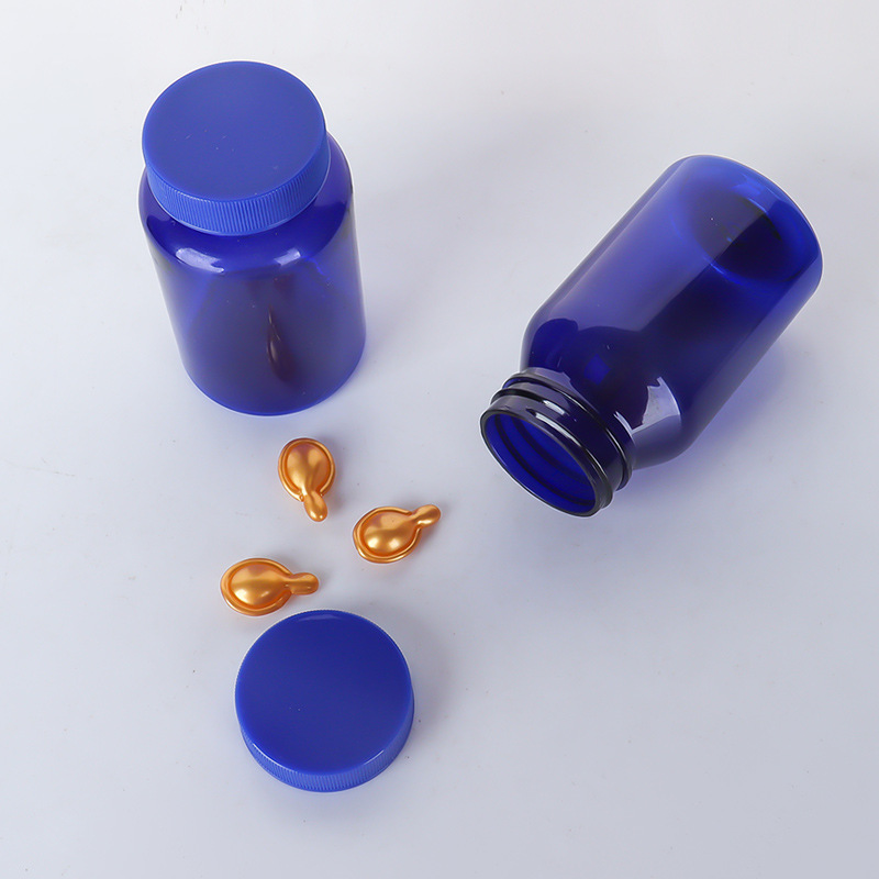 Botella de plástico azul 80–150 ml con tapa estriada, envase para suplementos o cápsulas.