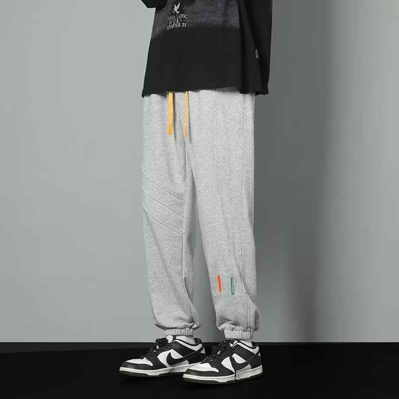 2024 primavera y otoño nuevos pantalones casuales para hombres de moda juvenil marca holgada pantalones deportivos de moda de moda