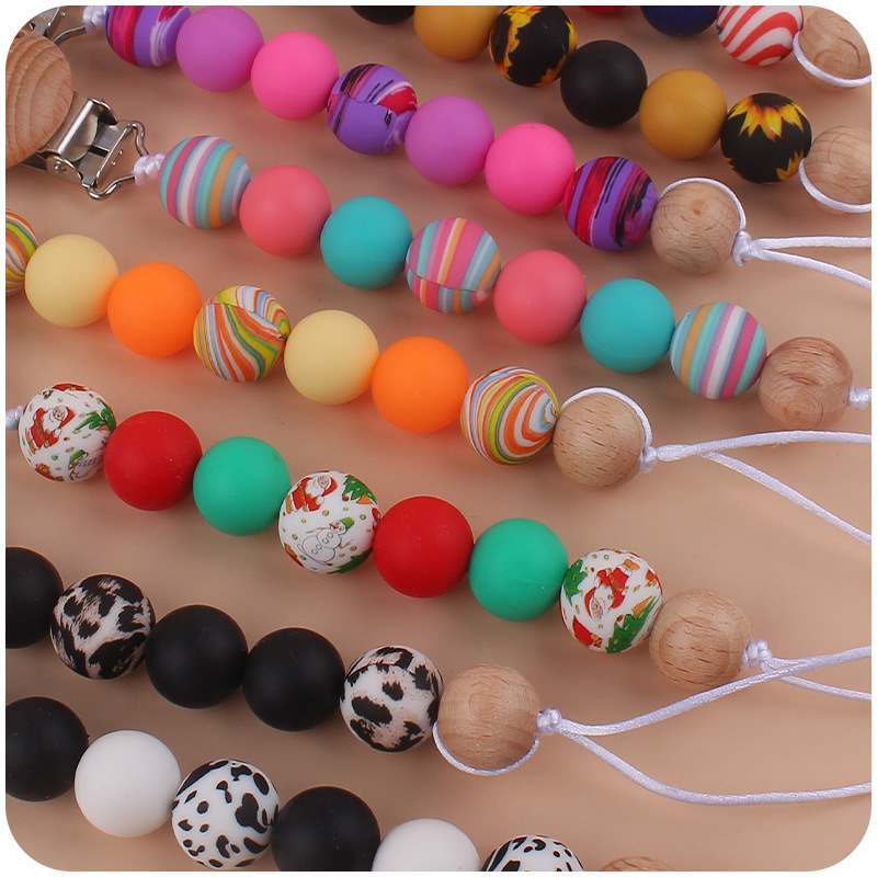 Nuevo bebé suministros chupete clip creativo bebé DIY color impresión cuentas de silicona mordedura chupete cadena