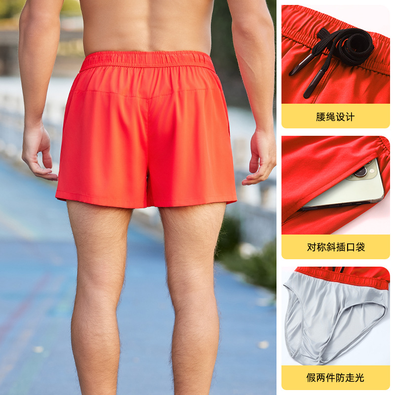 Pantalones cortos deportivos para correr anti-exposición de los hombres falsos de dos piezas de entrenamiento suelto al aire libre pantalones de fitness delgados pantalones cortos de secado rápido