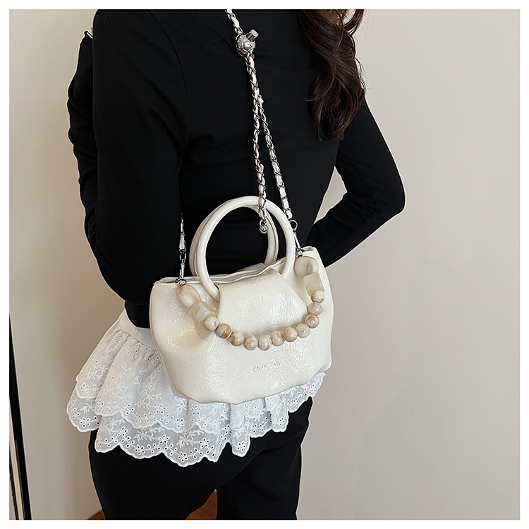 A stylish and trendy beaded bag for women, a new summer chain crossbody cloud bag for women in 2025 undefined