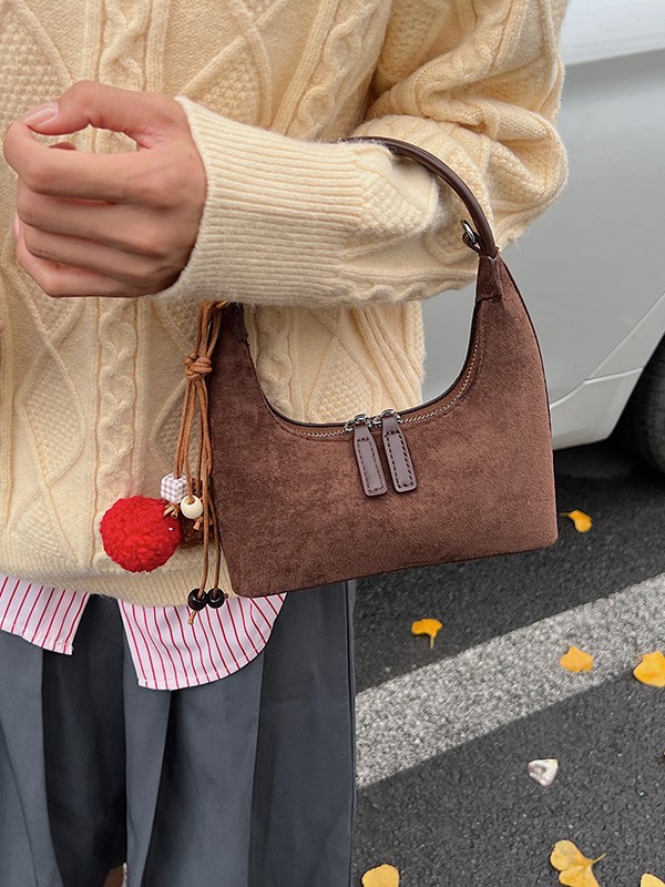 2025 nueva textura bolsas de brazo mujeres otoño de alto nivel bolsas de mano de nicho bolsas de mano coreanas bolsas de饺os versátiles