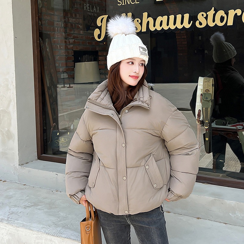 Invierno transfronterizo coreano 2025 nuevo abrigo de algodón de pluma de estilo universitario corto de mujer chaqueta de algodón de hombre pequeño Europa y América lote