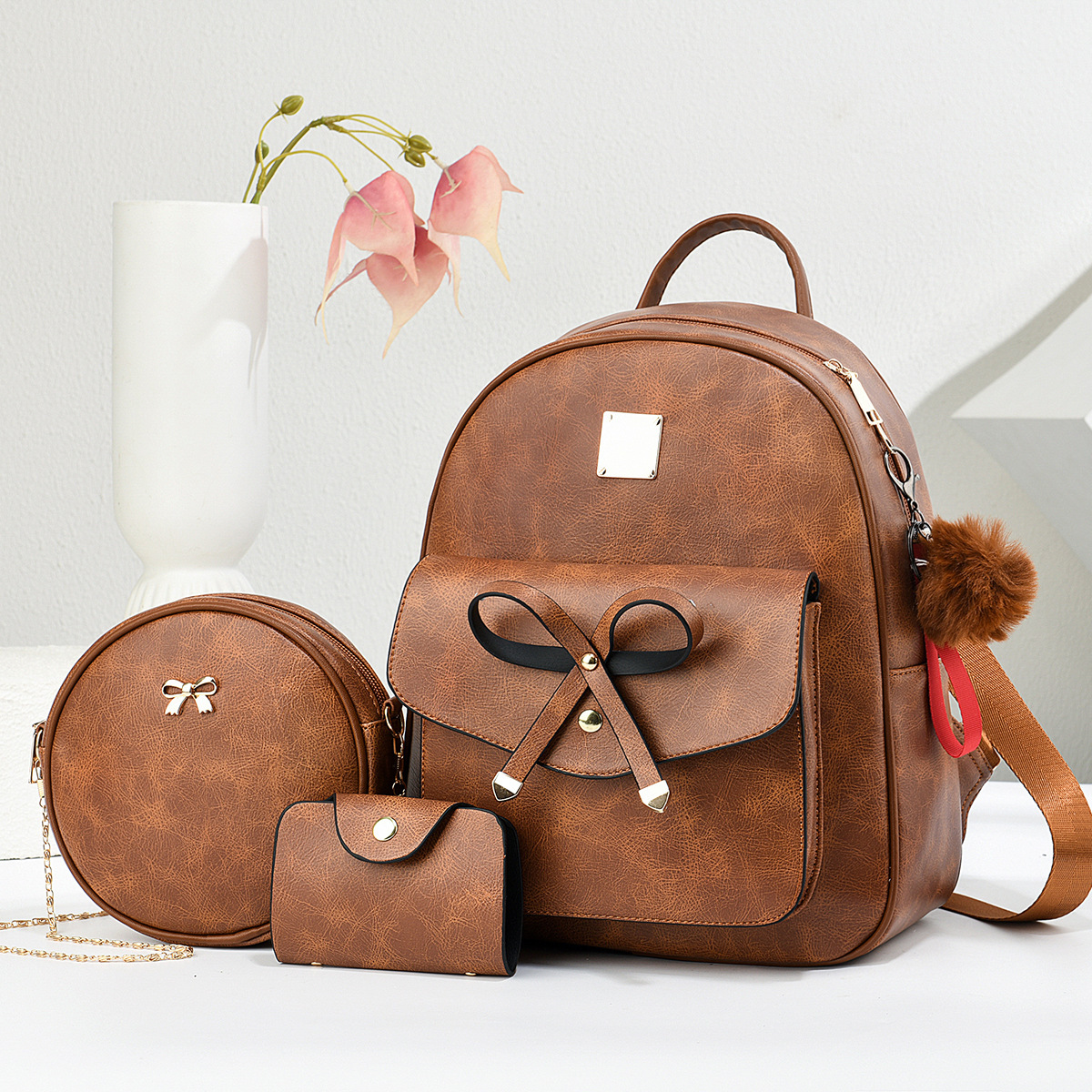 Nuevo estilo de moda de 2025 estilo coreano PU mochila pequeña multipropósito ligera de tres piezas mochila para mujeres