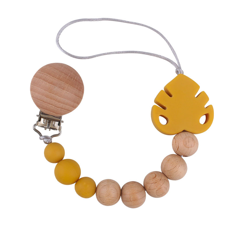Suministros para bebés creativo haya chupete clip molar juguete mordedor bebé hoja de silicona chupete cadena anti-caída de la cadena