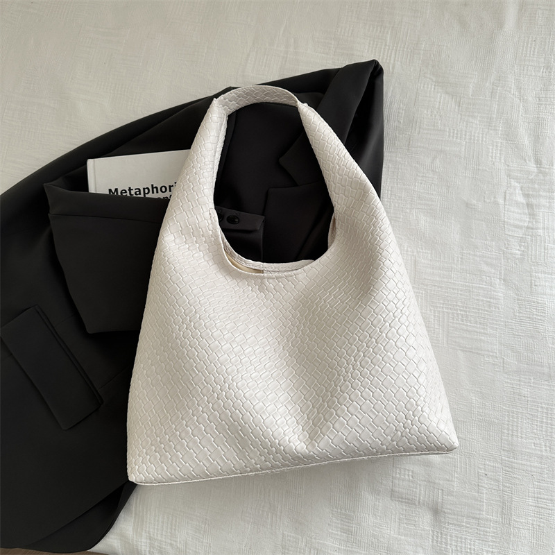 Casual diseño de gran capacidad de estilo extranjero bolso de hombro 2025 moda trenzado bolso de viaje simple retro bolso de brazo