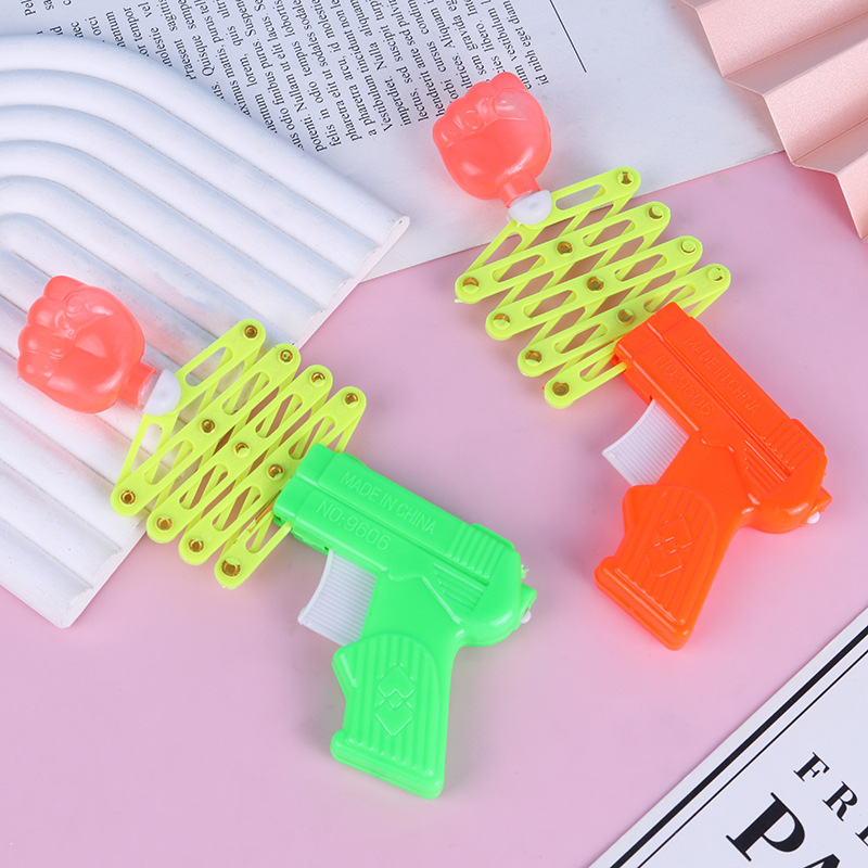 Magia de puño retráctil pistola elástica de resorte juguetes para niños después de los 80 nostálgicos y divertidos juguetes pequeños al por mayor