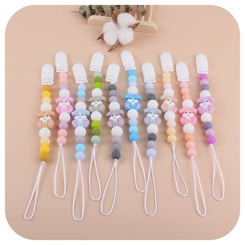 Nueva Cadena de chupete de silicona de dibujos animados creativo conejo de silicona juguete mordedor perlas molares pezón cadena anti-caída