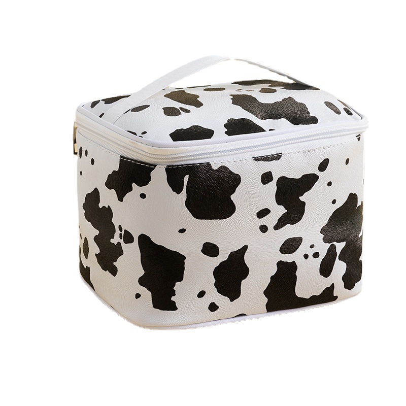 Patrón de vaca PU bolsa de cosméticos impermeable de gran capacidad de alto aspecto portátil avanzado bolsa de almacenamiento cuidado de la piel bolsa de lavado al por mayor