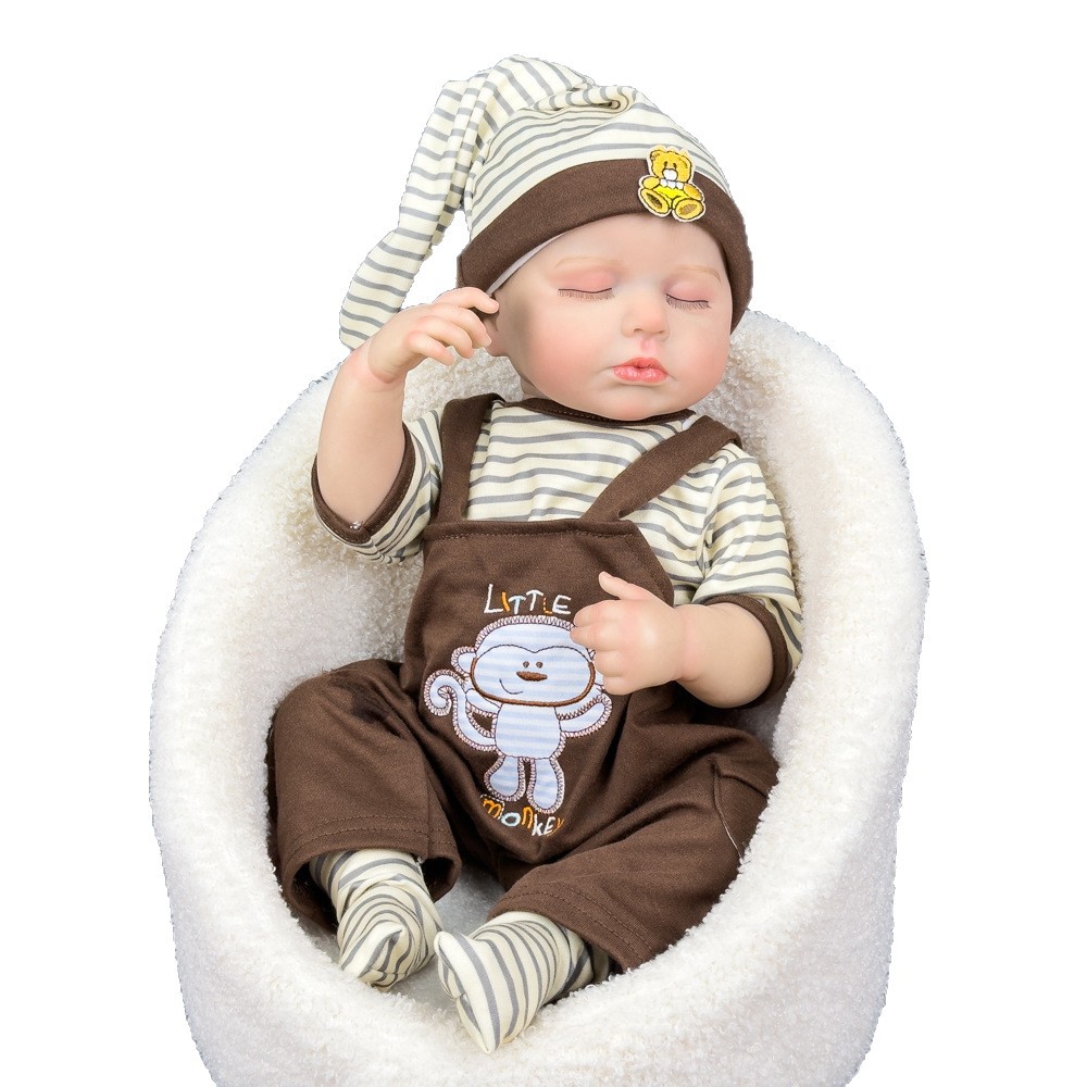 Explosiones transfronterizas de 20 pulgadas de alta calidad, muñeca de monos renacida, pantalones de cinturón, ojos cerrados, ropa simulada para bebés