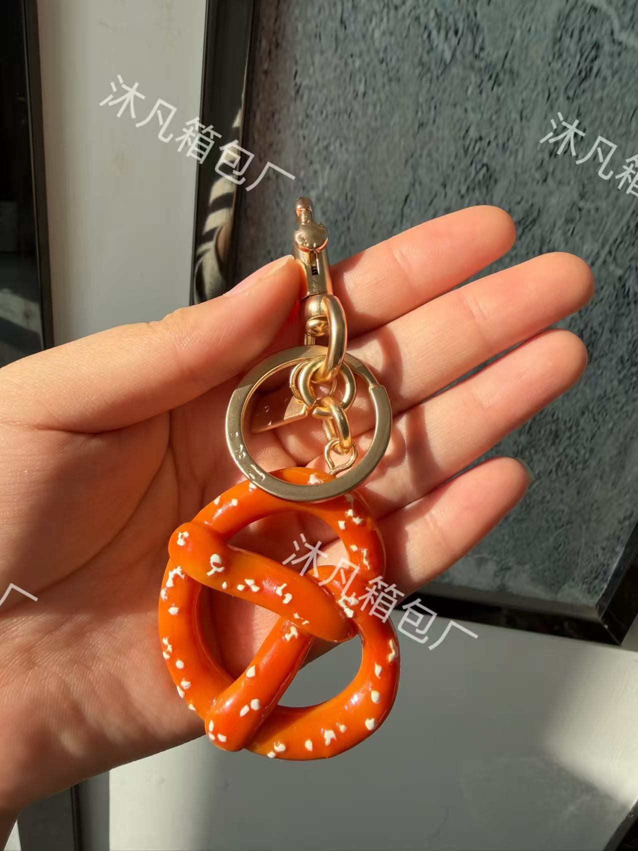 Coach Pretzel Key Holder And Bag Charm Gold