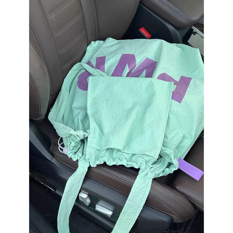 Korean-Style 2026 Letter Canvas Bag with Ins Print, Commuter Shoulder Bag with Drawstring, Large Capacity, Beige and Coffee Color A23 Korean-Style 2026 Letter Canvas Bag with Ins Print, Commuter Shoulder Bag with Drawstring, Large Capacity, Beige and Coffee Color A23