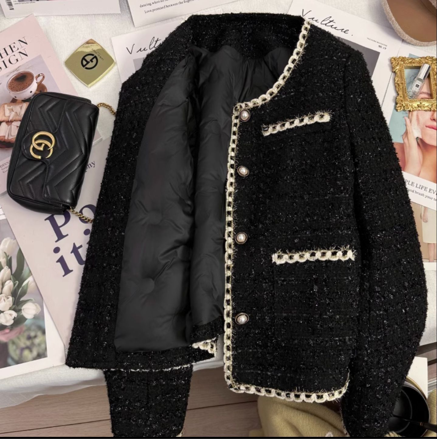 Black short down jacket with a Chanel-inspired design, new winter style for women, 2025. French style, warm, elegant, and sophisticated.