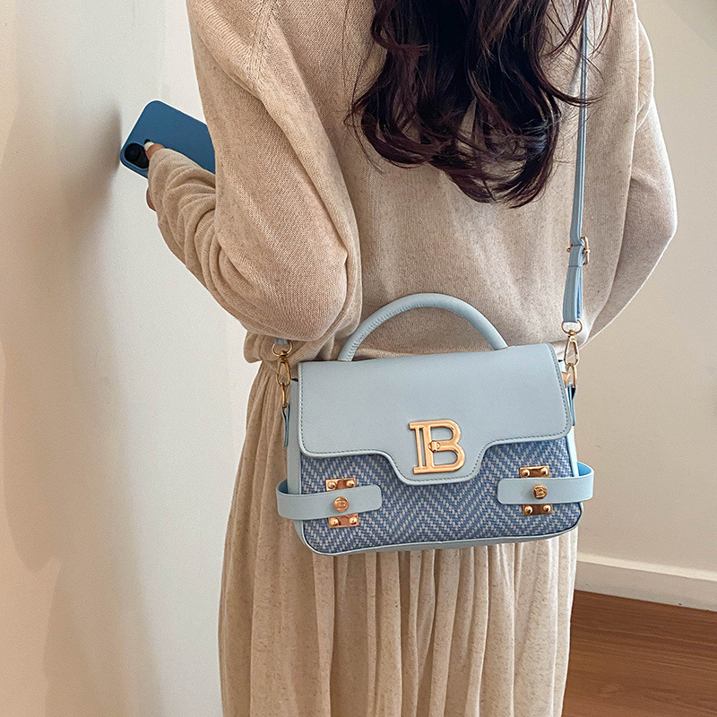 Bolso de mano de moda para mujeres 2026 primavera nuevo estilo coreano color sólido bolso extranjero texturizado bolso de hombro nicho