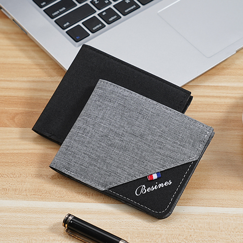 Cartera de color en contraste para hombre corta 2025 nueva marca de moda joven estudiante personalidad simple clip de camioneta plegable ultrafino