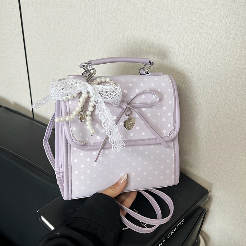 Bolsa de moda coreana lindas bajo las axilas 2026 primavera nueva bolsa de viaje simple, mochila de moda casual de alto valor.