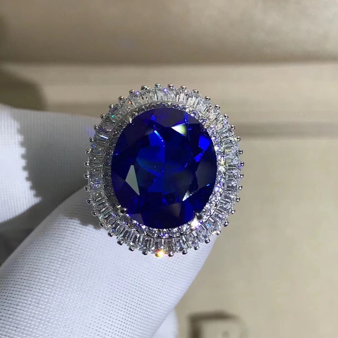 Comercio exterior transfronterizo exclusivo para anillo de zafiro sintético de alta calidad corte oval con incrustaciones de joyería de plata de 15 quilates