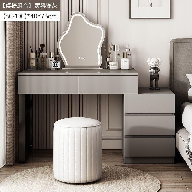 Wardrobe de madera maciza de tabla de roca dormitorio moderno simple pequeño tipo de lujo ligero de alta sensación armario de maquillaje en casa