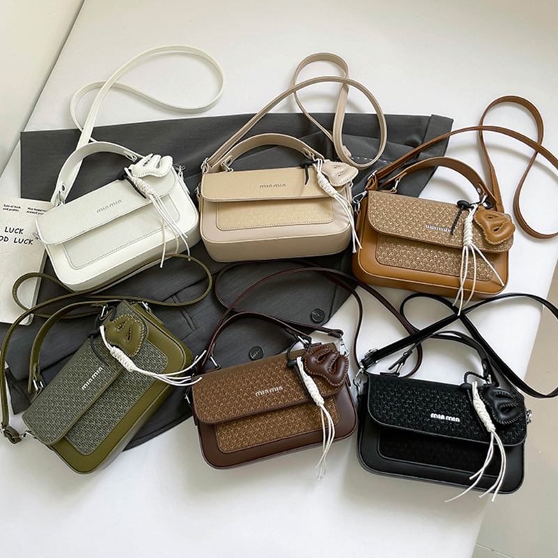 Textura al por mayor de lujo ligero bolso de mano bolso de mujer otoño 2025 nuevo estilo extranjero empalme bolso de hombro bolso de viaje