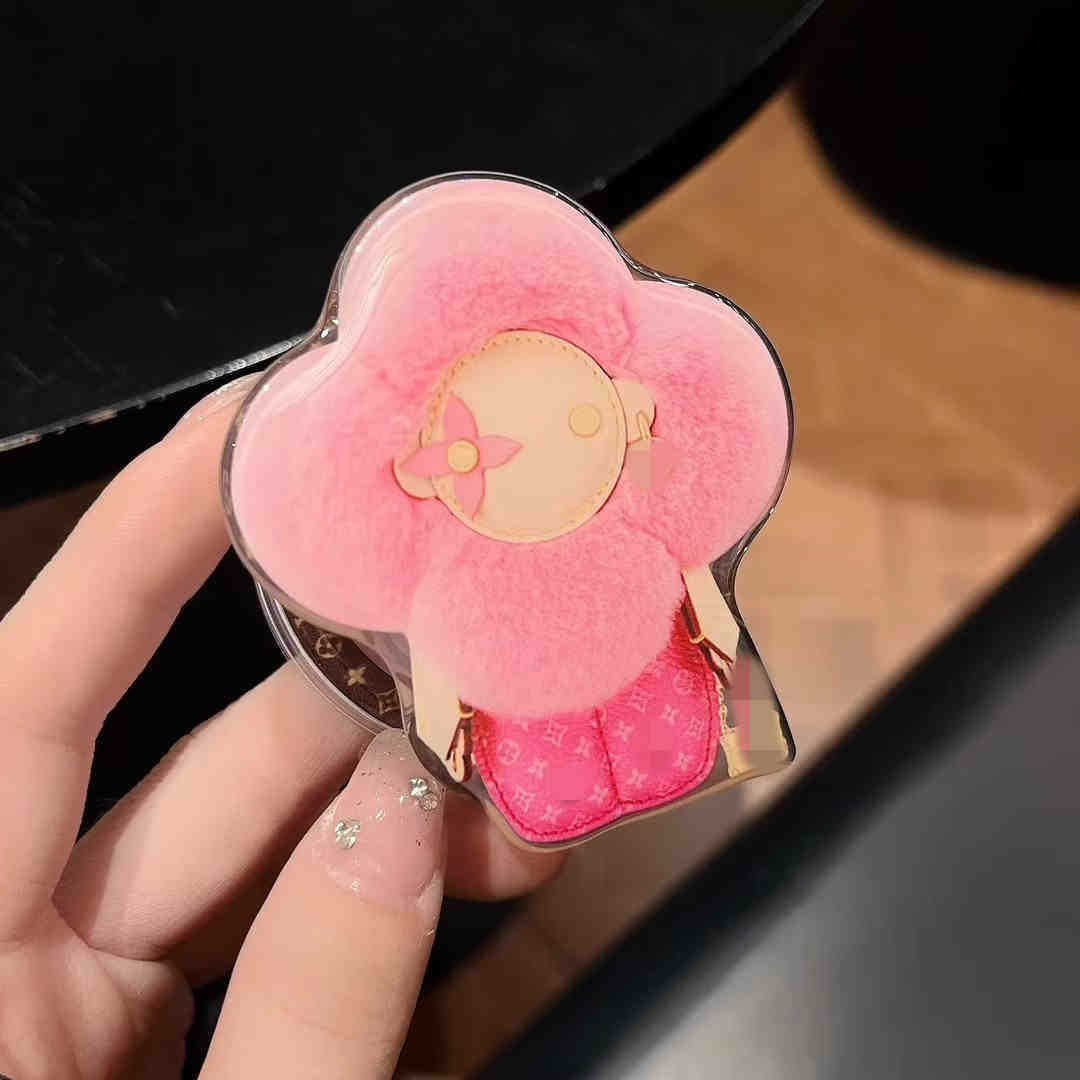 新型高級マグネットスタンドマグネット式携帯ケース通用太陽花マグネット式エアバッグスタンドはおしゃれで豪華です。