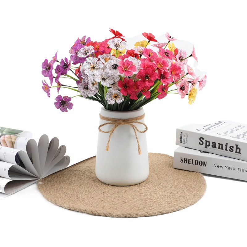 Simulación de plantas acuáticas plástico hierba de primavera flor violeta serigrafía hierba de primavera de cinco cabezas pequeña margarita flor falsa accesorios decorativos al por mayor