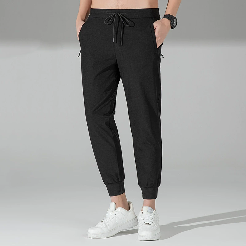 Лето 2025, повседневные брюки из ледяного шелка, тонкие брюки с девятью точками, быстросохнущие модные мужские свободные спортивные брюки, эластичные брюки в четырех направлениях