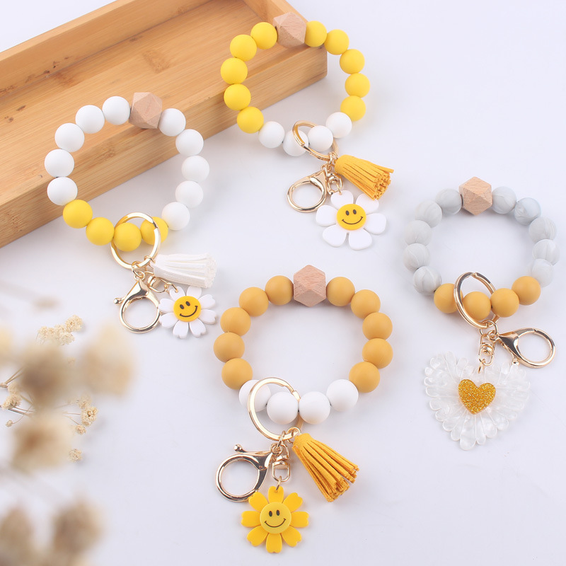 New Cartoon sunflower love keychain pendant handmade beaded tassel silicone bracelet wrist keychain