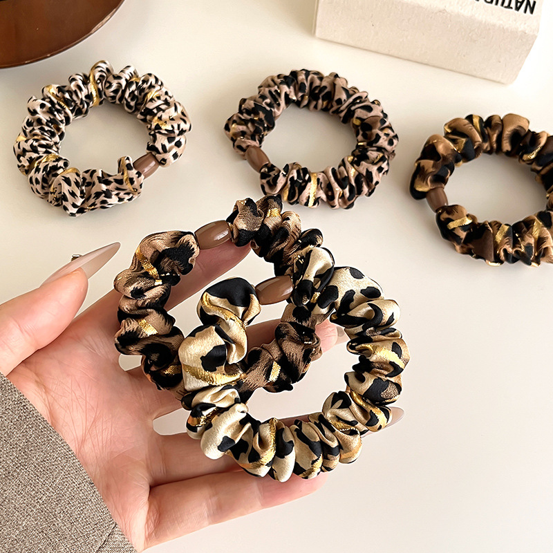 Temperamento europeo y americano estampado leopardo anillo de cabello simple de alta elástica cuerda de cabello gruesa cuerda de cabello de bolas duradera correa