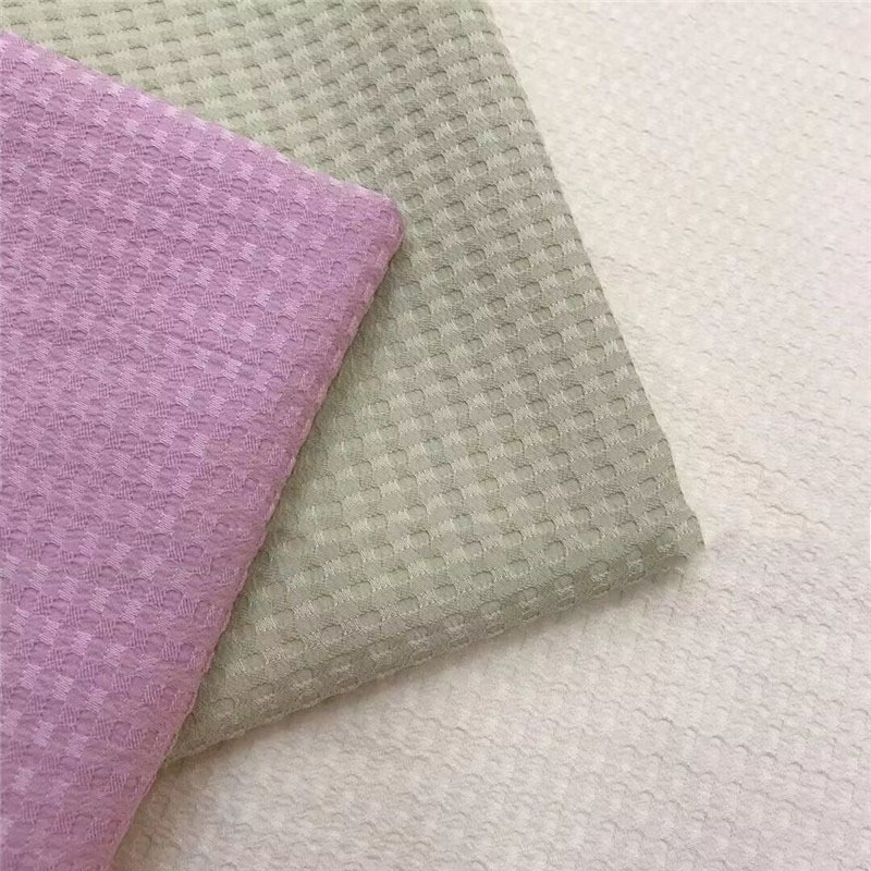 现货涤纶华夫格蜂窝提花面料全涤肌理感凹凸格鞋帽箱包家纺服装布