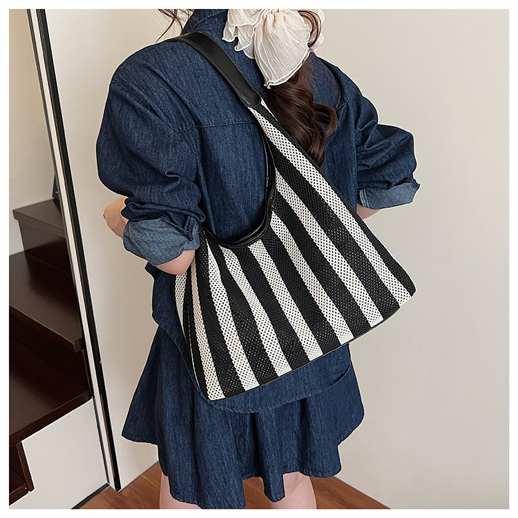 Korean summer new striped woven bag, casual vacation and laid-back style tote bag, hand and shoulder commuter tote bag undefined