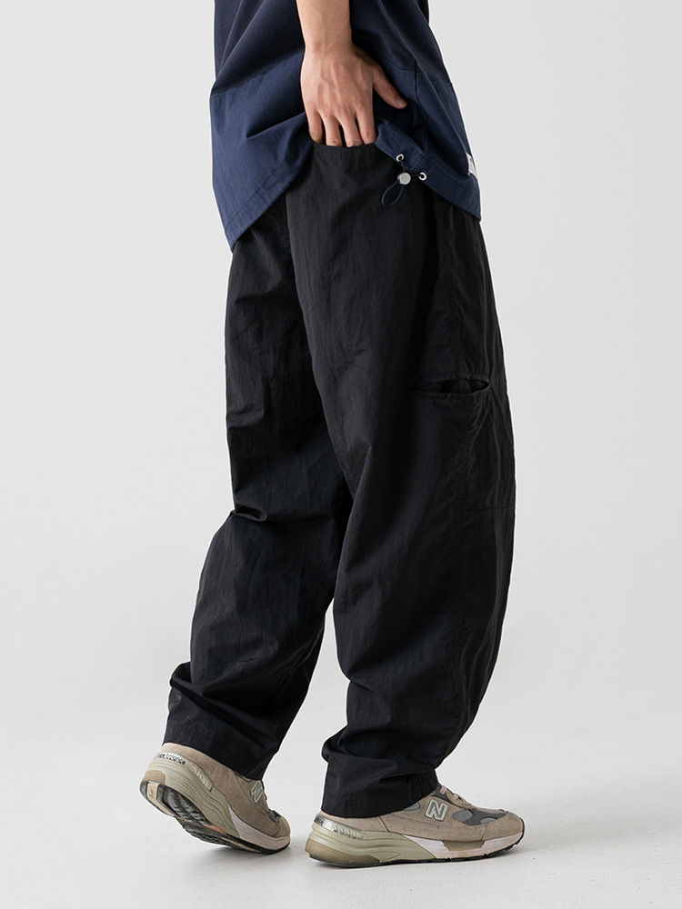 Pantalones casuales de ropa de trabajo de tela antisalpicaduras ligeramente arrugadas para hombres 2025 primavera nuevo cinturón con hebilla pantalones largos funcionales al aire libre