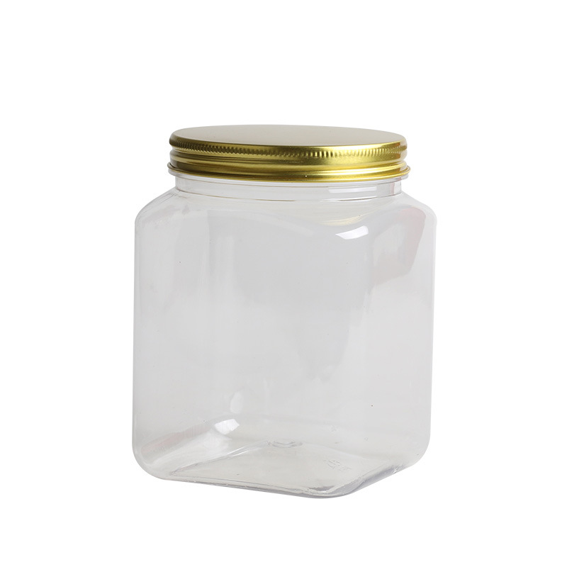 Fábrica en stock frasco de plástico cuadrado PET transparente grado alimenticio sellado frasco dos Jin botella de miel cubierta de aluminio jarra de granos