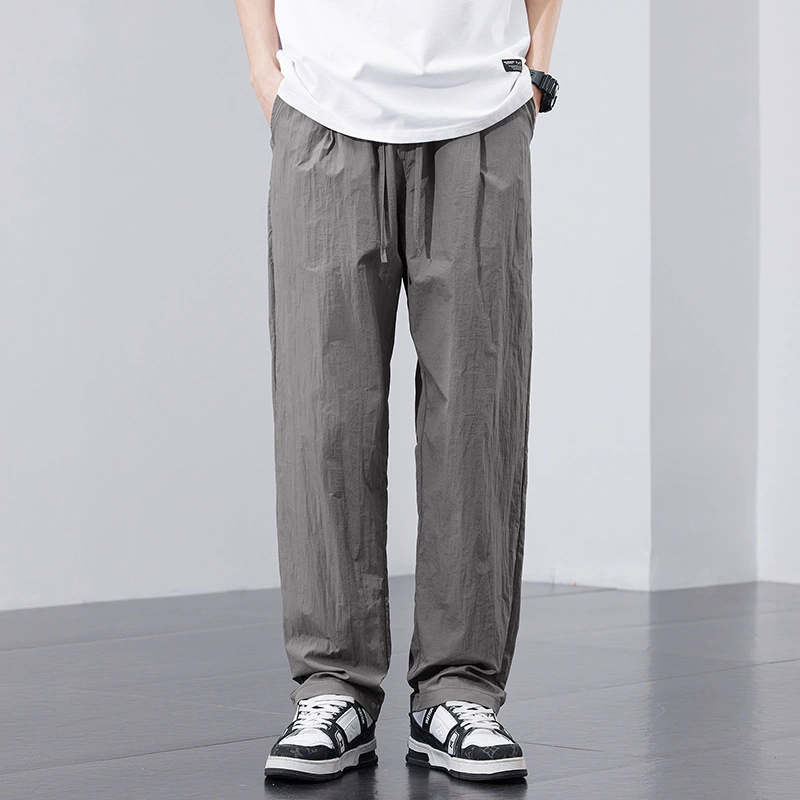 Весенне-летние быстросохнущие тонкие повседневные брюки из ледяного шелка для мужчин с эластичной резинкой на талии, универсальные свободные прямые брюки для пар.