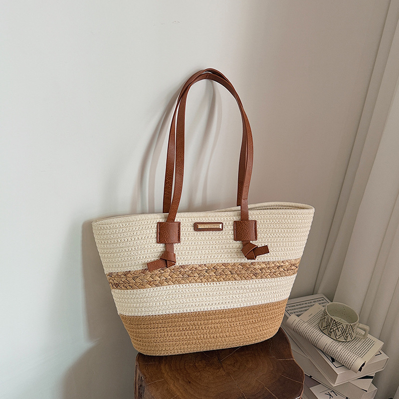 Bolso de mano de gran capacidad para mujeres 2026 verano nuevo estilo de moda tejido bolso de hombro brazaleta de viaje bolsa de ocio