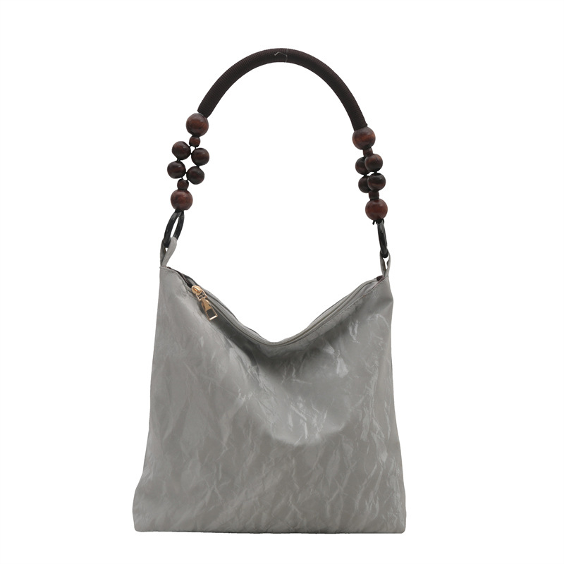 Nueva bolsa de estilo chino para mujeres 2024 verano nuevo estilo simple de moda seda bolso inferior nicho universal bolso de hombro casual