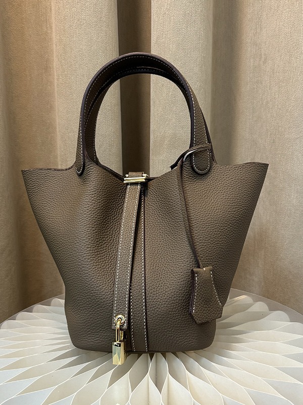 Bolsa de mano de nicho de piel de vaca de alta versión, bolsa de cestas de verduras, cuero real de gran capacidad, bolsa de cubo de alta calidad.