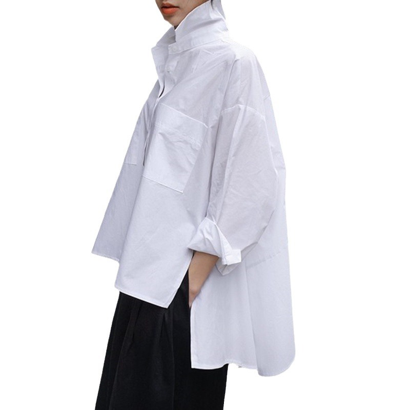春秋の服の新型の白いシャツの女性の韓国版のゆったりしている大きいサイズのマント型の長袖の不規則なシャツのファッション的な上着
