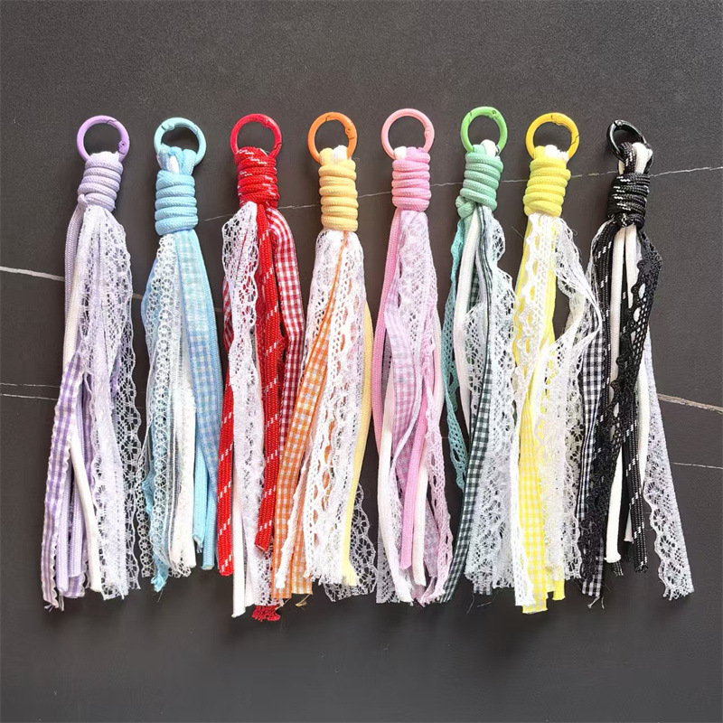 Accesorios de éxito en línea de teléfono móvil cordón de encaje de viento de dopamina accesorios bolsos llaveros colgantes al por mayor