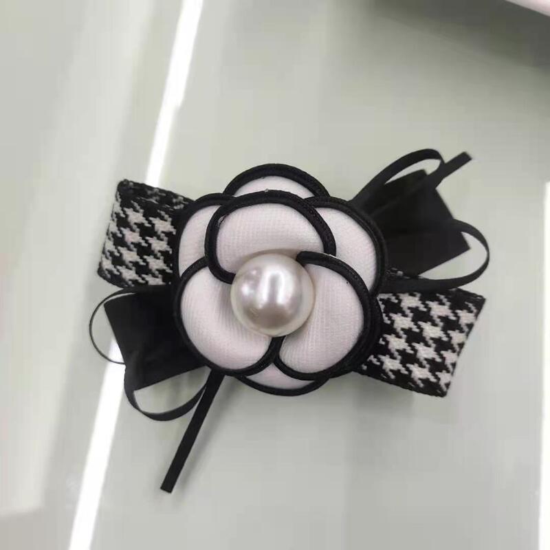 韓国の小香風ツバキの花の千鳥の格の蝶結びのスプリングは後頭部の頭を挟みます。|undefined