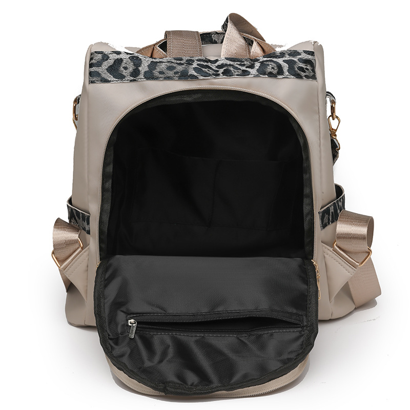 Nueva mochila con estampado de leopardo para mujer 2024 nueva mochila de viaje de todo fósforo de moda de gran capacidad mochila escolar para estudiantes de un solo hombro