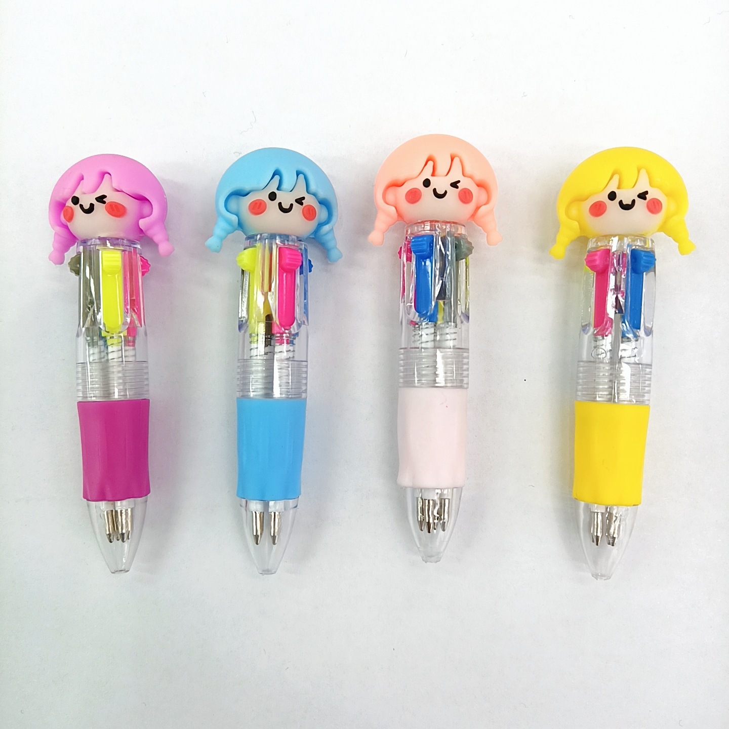 Fabricante mayorista de cuatro colores bolígrafo de silicona bolígrafo multicolor de dibujos animados cabeza portátil de estudiantes
