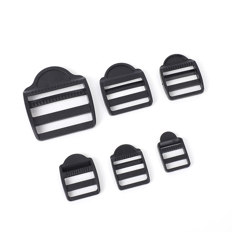 Accesorios de maleta de plástico negro trapezoidal ajustable botón POM mochila botón de botón de banda de tela plana cuatro botones