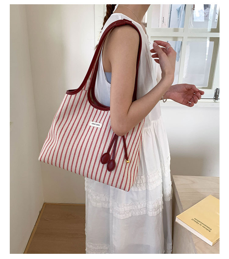 2025 Casual Commuter Tote bag, women's niche striped simple and fashionable hand-held shoulder bag, large-capacity underarm bag undefined