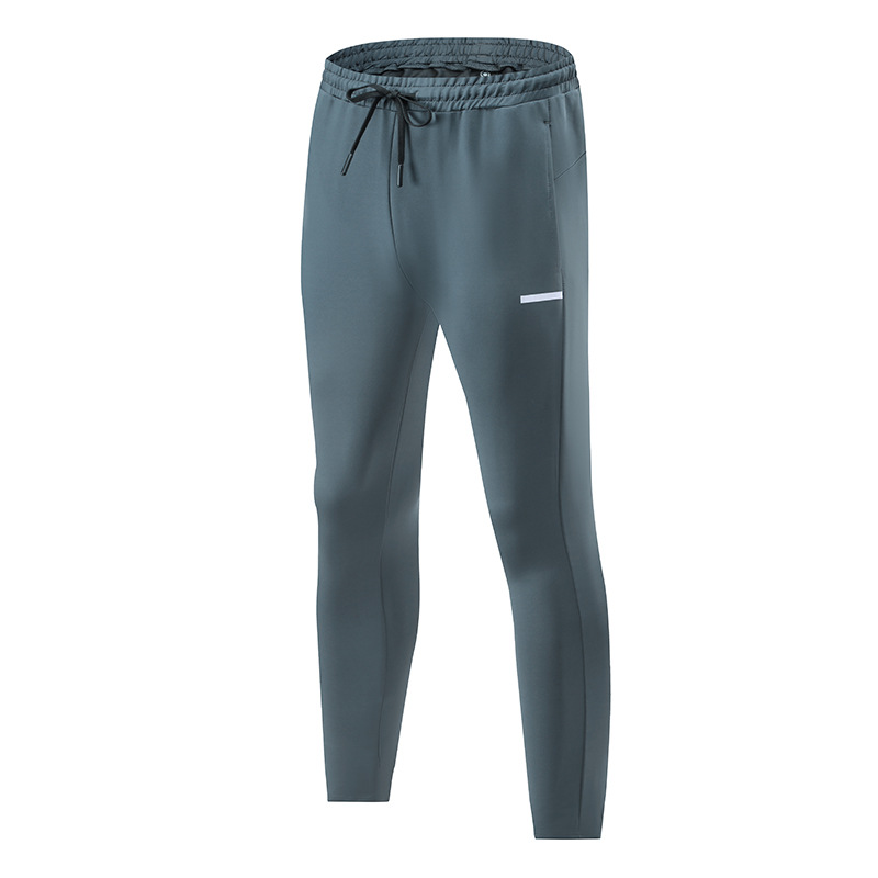 Primavera y otoño de los hombres al aire libre corriendo Pantalones deportivos de secado rápido transpirable flojo más tamaño casual estiramiento pantalones en stock impreso NK