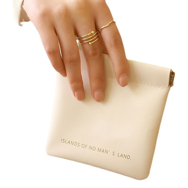 Bolsa de almacenamiento de servilleta sanitaria de color sólido de estilo coreano engrosada PU multi-funcional bolsa de lápiz labial impermeable tía toalla bolsa de almacenamiento al por mayor