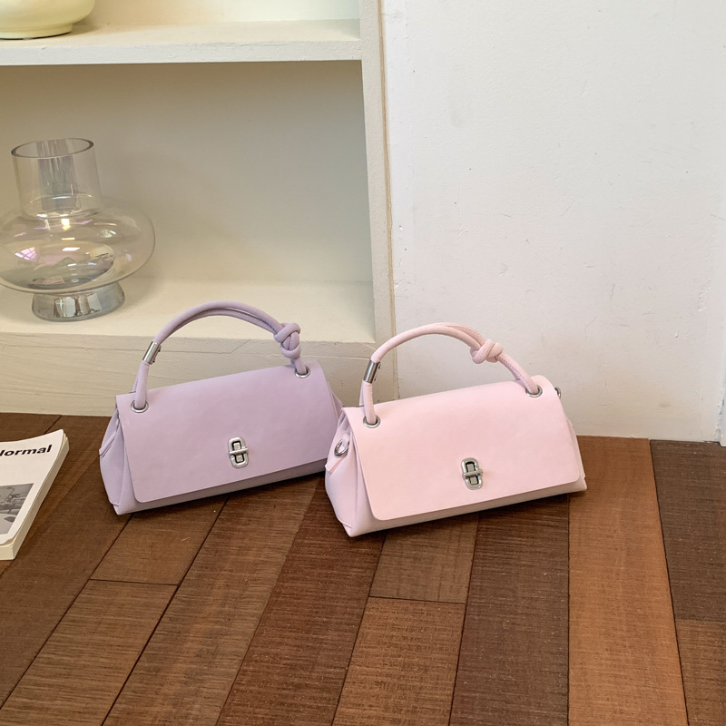Bolso de mano simple de alto valor para mujeres verano 2026 nueva moda ocio atmósfera de viaje mochila de hombro