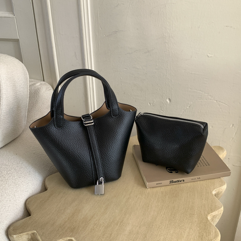 Cestas clásicas de platos bolsas de cubo de mano nicho coreano de litchi de textura alta moda versátil bolso de mochila