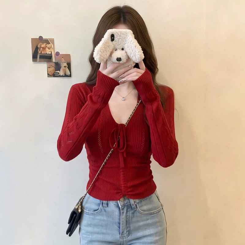 Long-sleeved, fine vertical-striped, front-tie knit top for women, featuring a delicate, open-sleeve design, perfect for autumn