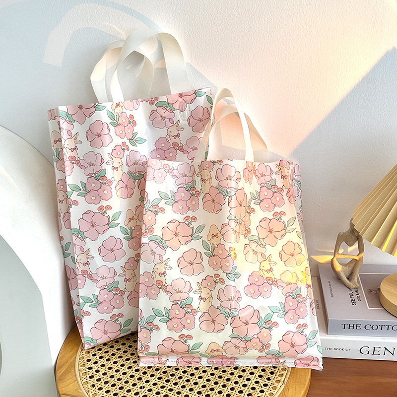 Nueva Rosa flor de cerezo tienda de ropa bolsa de compras bolsa de regalo fresco Lindo bolso de plástico grueso cosméticos