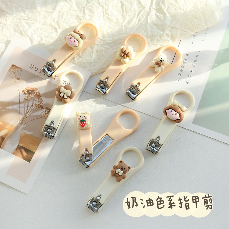 Cute cartoon nail clippers cream color nail clippers creative folding anti-splash student manicure portable nail clippers Cute cartoon nail clippers cream color nail clippers creative folding anti-splash student manicure portable nail clippers
